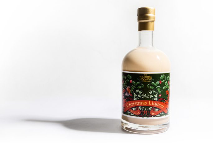 A bottle of The Wiltshire Liqueur Company's Christmas Cream Liqueur on a white background.